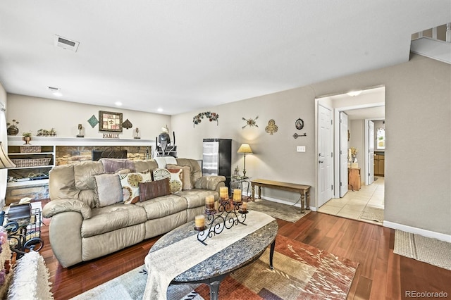 12625 W 66th Cir, Arvada, CO 80004 - living room with wood finished floors, baseboards, and recessed lighting