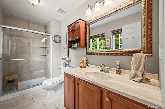 12625 W 66th Cir, Arvada, CO 80004 - full bath featuring vanity, toilet, a shower stall, and tile patterned floors