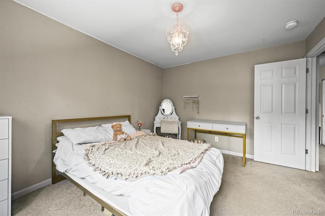 12625 W 66th Cir, Arvada, CO 80004 - bedroom featuring carpet floors, baseboards, and a chandelier