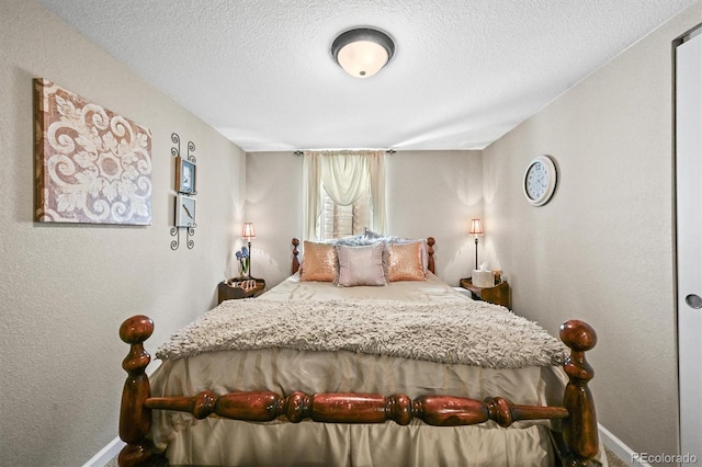 12625 W 66th Cir, Arvada, CO 80004 - bedroom with baseboards and a textured ceiling
