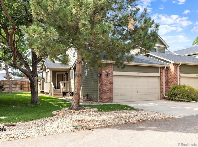 view of front of home featuring a garage and a front lawn