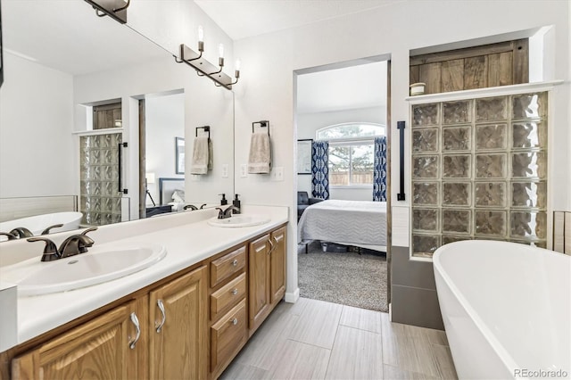 bathroom with vanity and a bathing tub