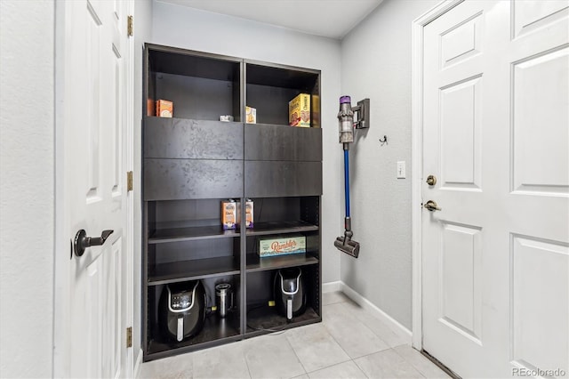 mudroom with light tile patterned floors