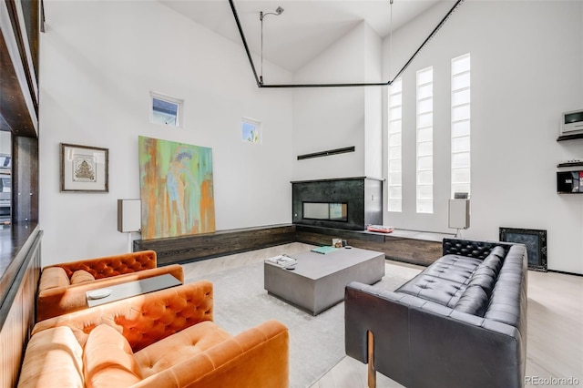 2801 Lawrence St, Denver, CO 80205 - living area with high vaulted ceiling, a fireplace, and plenty of natural light