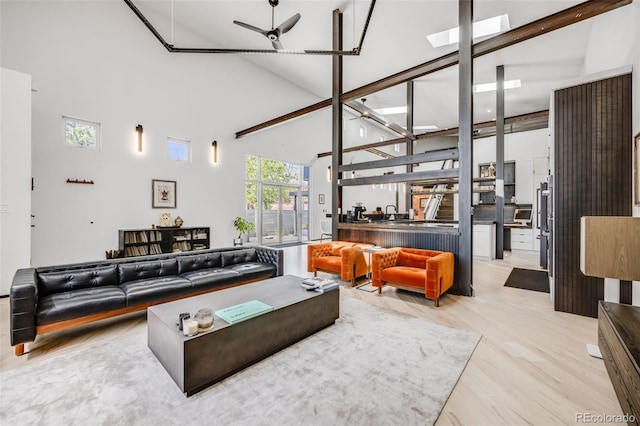 2801 Lawrence St, Denver, CO 80205 - living room featuring high vaulted ceiling and wood finished floors