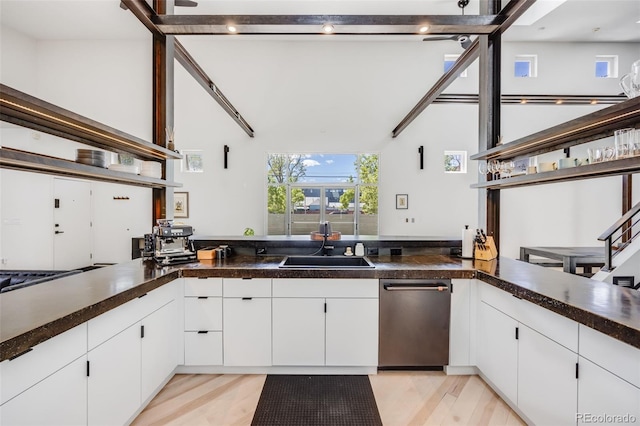 2801 Lawrence St, Denver, CO 80205 - kitchen featuring a sink, open shelves, stainless steel dishwasher, light wood finished floors, and high vaulted ceiling