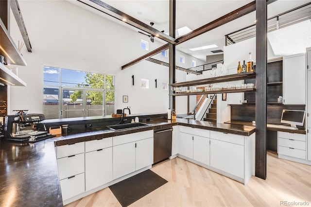 2801 Lawrence St, Denver, CO 80205 - kitchen with a sink, dishwasher, white cabinetry, dark countertops, and open shelves