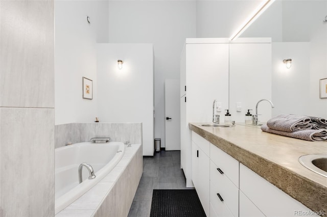 2801 Lawrence St, Denver, CO 80205 - bathroom featuring double vanity and a bath