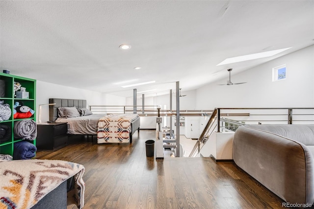 2801 Lawrence St, Denver, CO 80205 - bedroom with wood finished floors, a skylight, recessed lighting, and vaulted ceiling