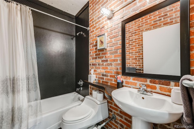 2801 Lawrence St, Denver, CO 80205 - bathroom featuring brick wall, shower / bath combination with curtain, a sink, and toilet