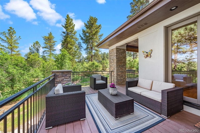 wooden terrace featuring outdoor lounge area