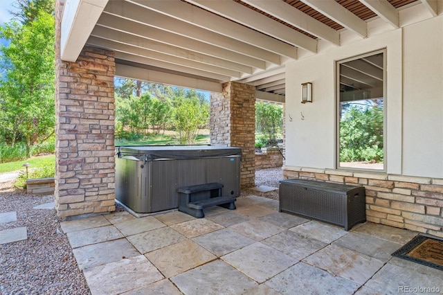 view of patio with a hot tub