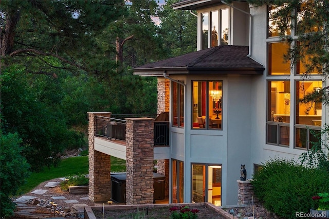 rear view of house with a balcony