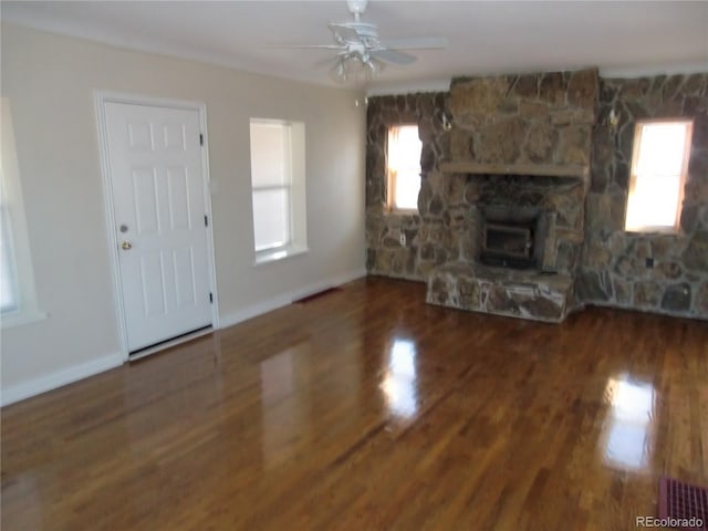 unfurnished living room with dark hardwood / wood-style flooring and ceiling fan