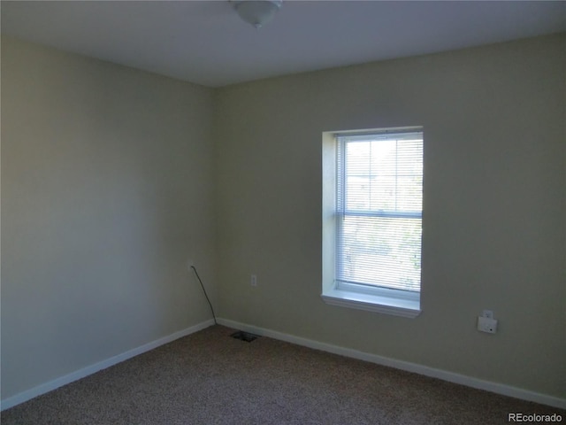 spare room featuring carpet floors