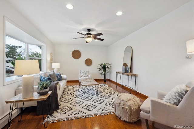 living area with recessed lighting, ceiling fan, wood finished floors, and a baseboard radiator