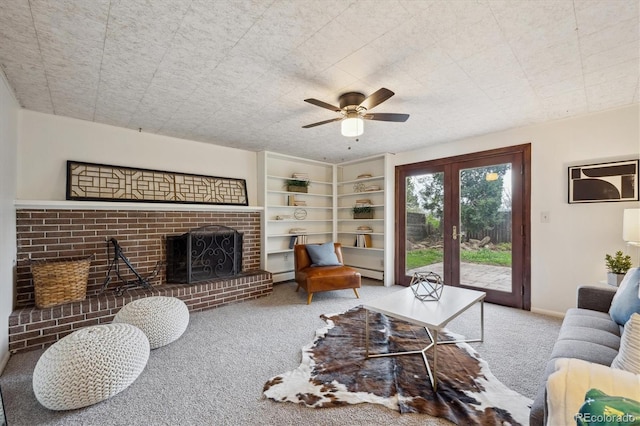carpeted living room with a brick fireplace, ceiling fan, baseboards, and baseboard heating
