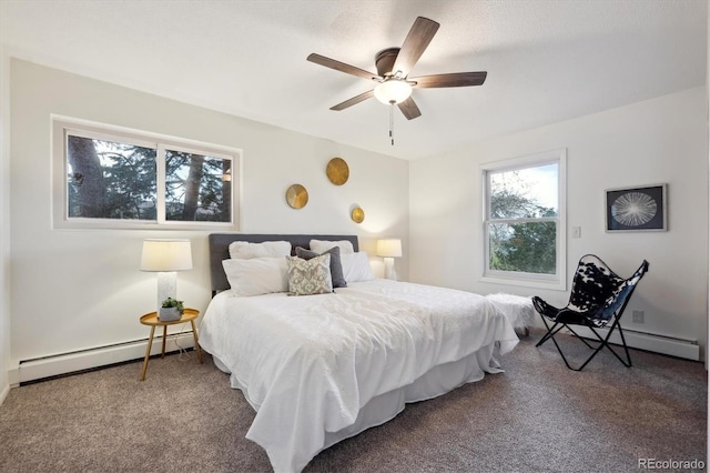 carpeted bedroom featuring baseboards, ceiling fan, and a baseboard heating unit