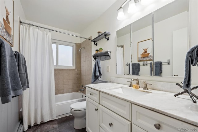 full bathroom featuring shower / bath combo with shower curtain, toilet, and vanity