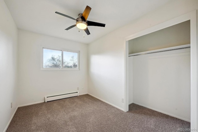 unfurnished bedroom with baseboards, carpet flooring, and a baseboard heating unit