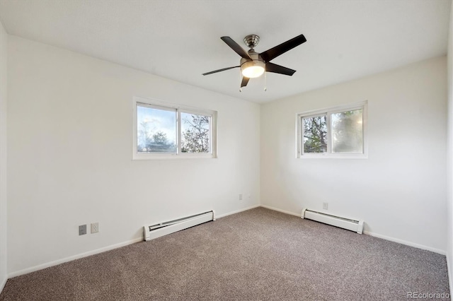 carpeted empty room featuring plenty of natural light, a baseboard radiator, and ceiling fan