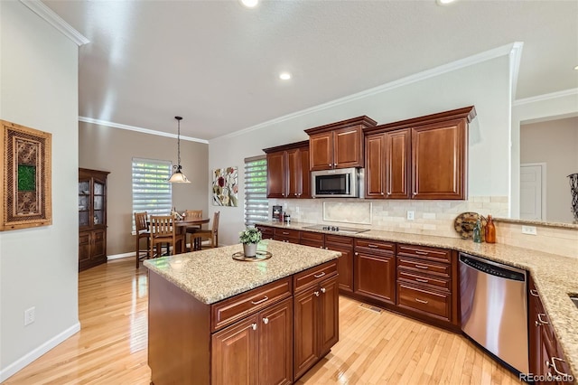 16626 Las Brisas Dr, Broomfield, CO 80023 - kitchen with appliances with stainless steel finishes, light wood-type flooring, tasteful backsplash, light stone countertops, and ornamental molding