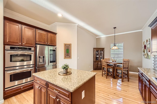 16626 Las Brisas Dr, Broomfield, CO 80023 - kitchen featuring stainless steel appliances, light stone countertops, light wood finished floors, ornamental molding, and decorative light fixtures