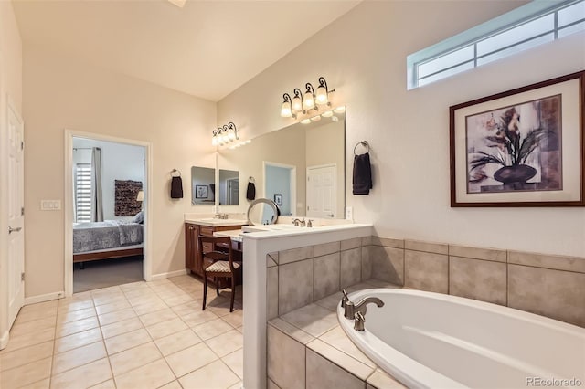 16626 Las Brisas Dr, Broomfield, CO 80023 - bathroom featuring a garden tub, double vanity, ensuite bathroom, and tile patterned floors