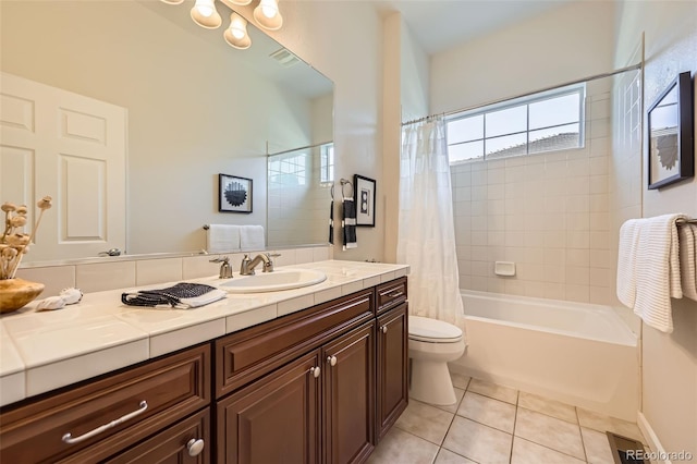 16626 Las Brisas Dr, Broomfield, CO 80023 - full bathroom featuring tile patterned floors, vanity, and shower / tub combo with curtain