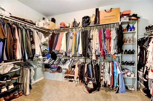 walk in closet with carpet