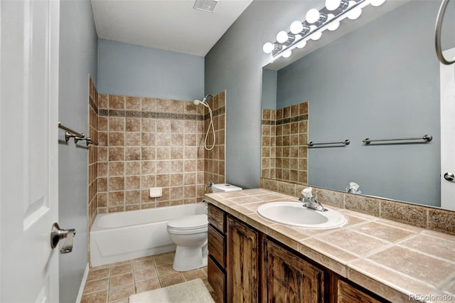 full bathroom featuring tile patterned flooring, vanity, toilet, and tub / shower combination