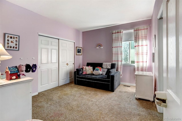 living area with light carpet