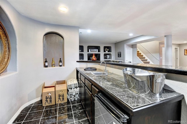 bar with built in shelves and sink