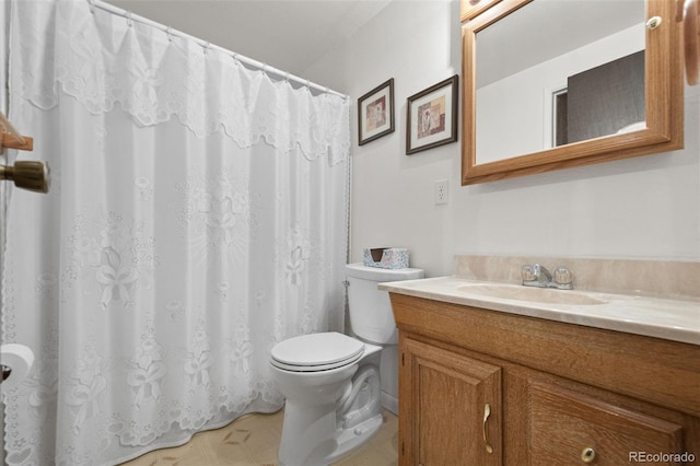 bathroom with vanity, toilet, and a shower with curtain