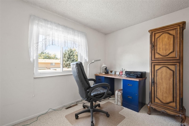 office area with light carpet and a textured ceiling