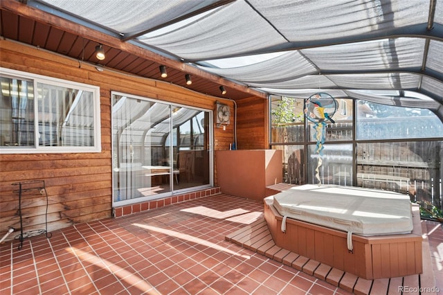 view of patio featuring a covered hot tub