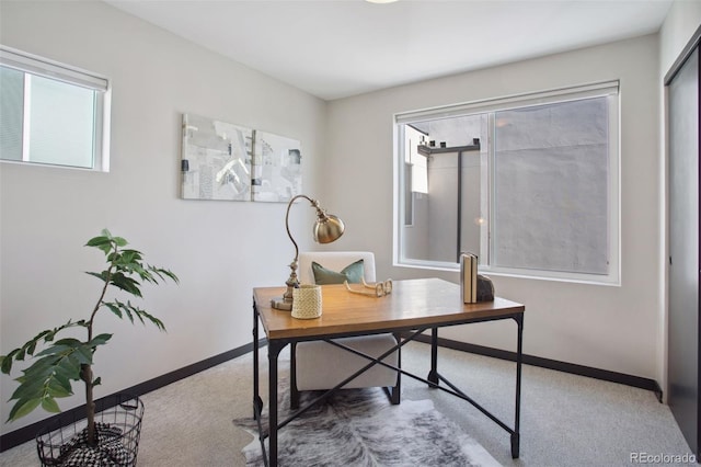 home office featuring carpet floors and baseboards