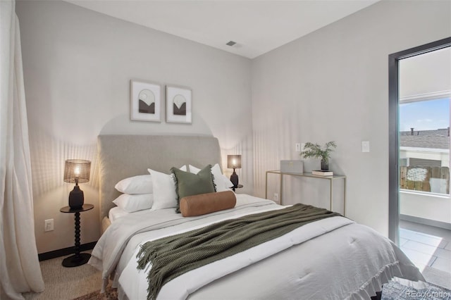 bedroom featuring visible vents and baseboards