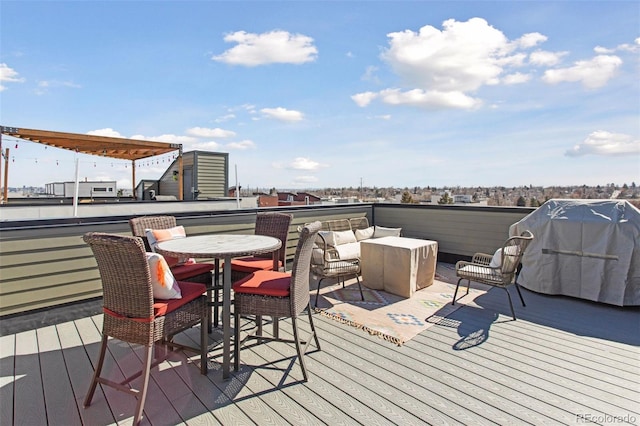 wooden terrace featuring outdoor dining area and area for grilling