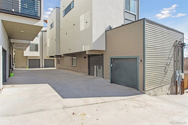 view of side of home featuring a garage