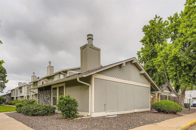 10295 E Evans Ave Unit 114, Aurora, CO 80247 - view of property exterior with a chimney