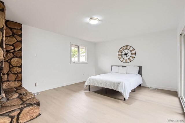 10295 E Evans Ave Unit 114, Aurora, CO 80247 - bedroom featuring light wood finished floors