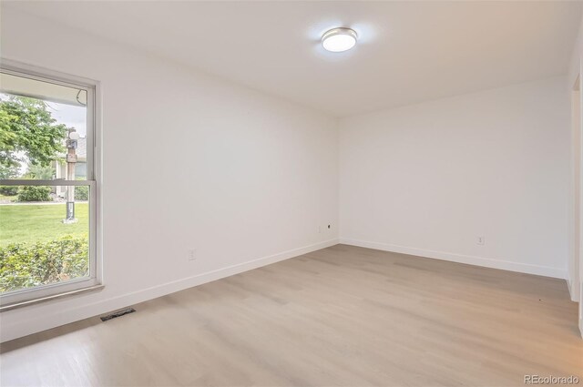 10295 E Evans Ave Unit 114, Aurora, CO 80247 - empty room with light wood-style floors and baseboards