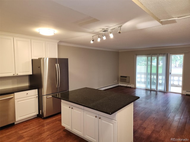 9300 E Center Ave Unit 6A, Denver, CO 80247 - kitchen with appliances with stainless steel finishes, dark wood-style flooring, crown molding, a kitchen island, and dark countertops