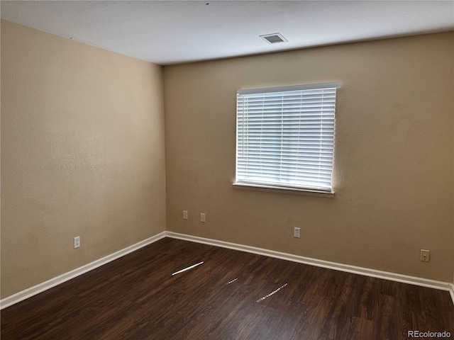 20304 E 47th Pl, Denver, CO 80249 - unfurnished room with wood finished floors and baseboards