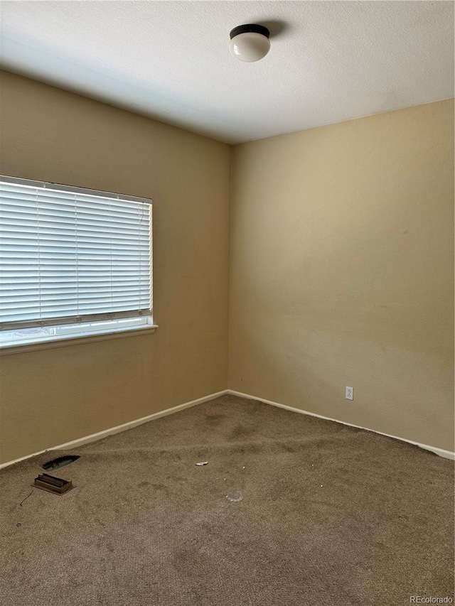20304 E 47th Pl, Denver, CO 80249 - empty room featuring carpet flooring and baseboards