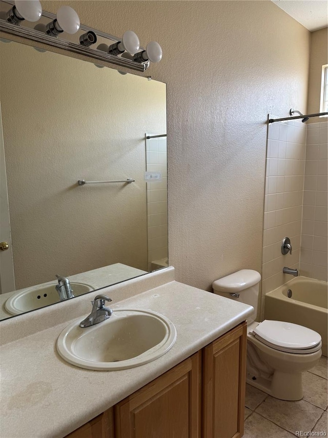 20304 E 47th Pl, Denver, CO 80249 - full bath featuring tile patterned flooring, vanity, toilet, and  shower combination