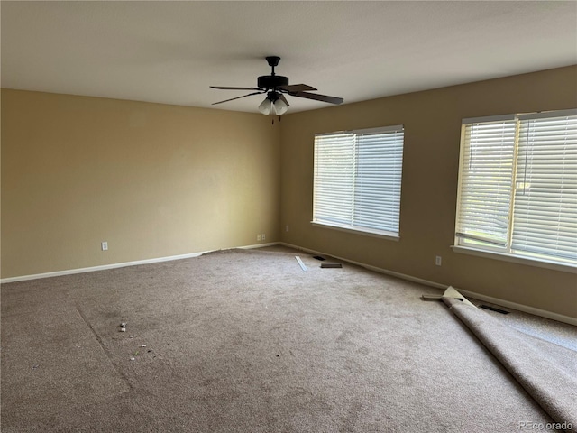 20304 E 47th Pl, Denver, CO 80249 - carpeted spare room with baseboards and a ceiling fan