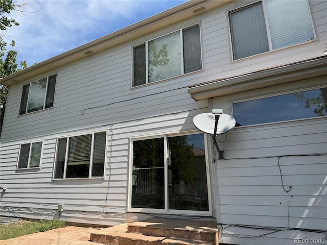 20304 E 47th Pl, Denver, CO 80249 - view of property exterior featuring entry steps
