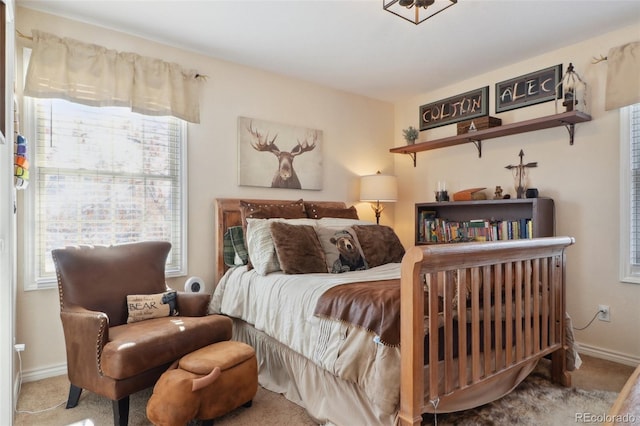 bedroom with carpet flooring and multiple windows